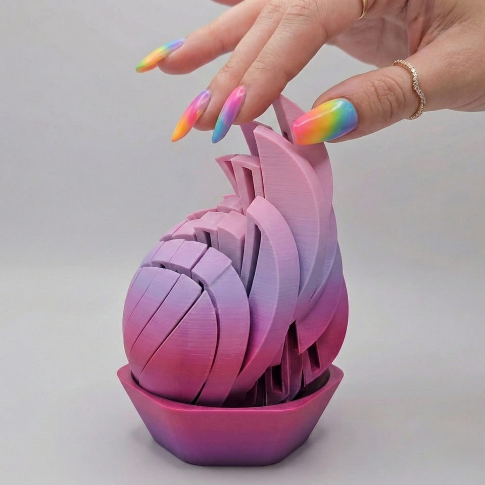 Slime ball fidget toy demonstrated in hand